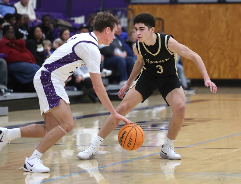 Sycamore's Marcus Johnson plays defense against Rochelle's Van Gerber Friday, Dec. 5, 2025, during their game at Rochelle High School.
