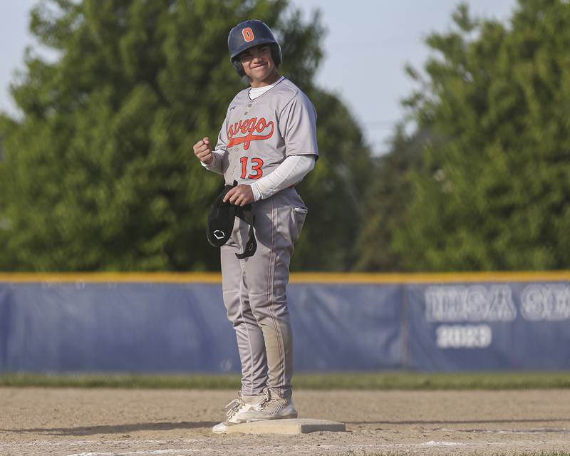 Oswego's Bryson Norwood (13) reacts after pulling up to second base during baseball game between Oswego East at Oswego. Monday, May 19, 2025 in Oswego.