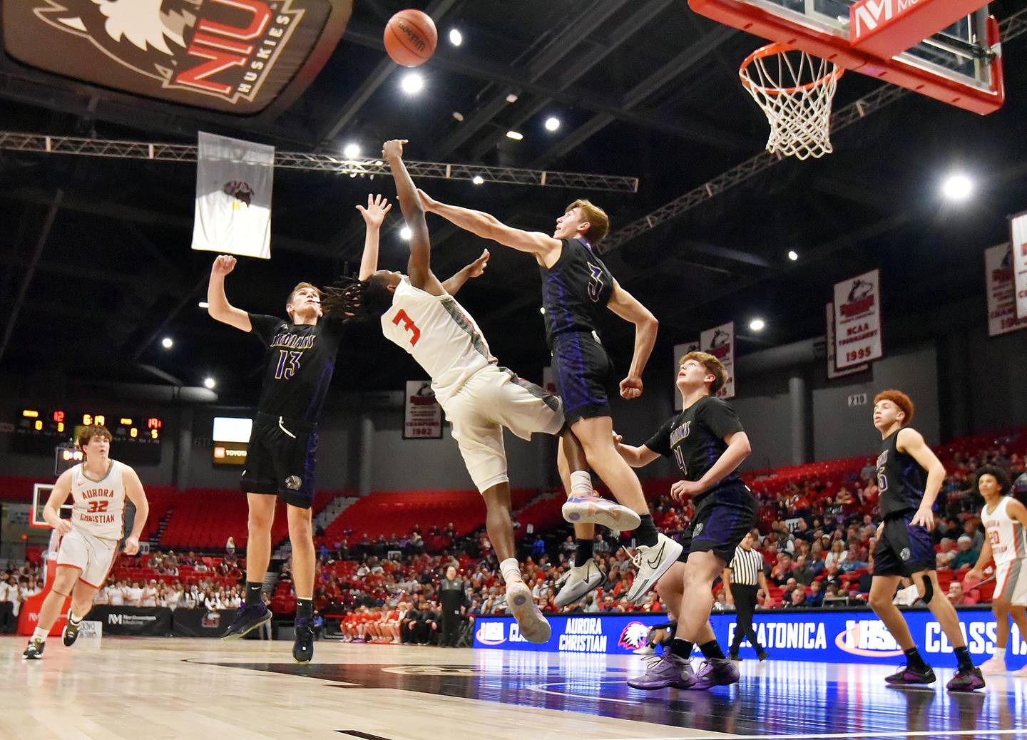 Aurora Christian High School’s Marshawn Cocroft gets a shot off against Pecatonica High School’s Cooper Hoffman in the Class 1A supersectional boys basketball game at Northern Illinois Unversity on Monday, March 4, 2024.