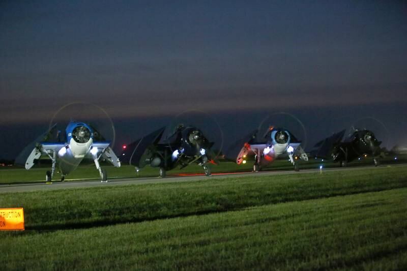 TBM Avengers emits flames during the TBM Night Run-up of the the TBM Avenger Reunion on Friday, May 19, 2023 at the Illinois Valley Regional Airport in Peru.
