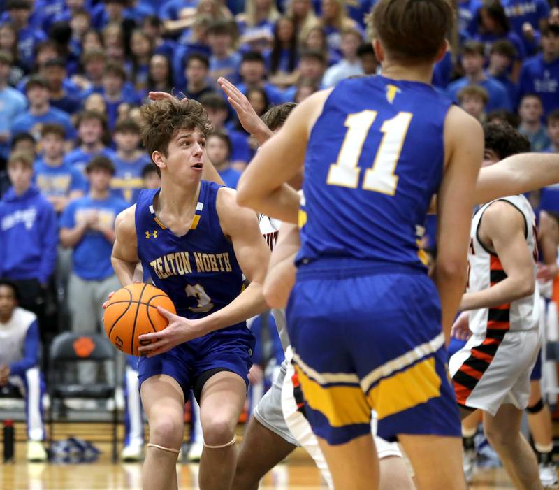 Wheaton North’s Cal MacKay looks for an opening during a game against Wheaton Warrenville South on Friday, Feb. 7, 2025 in Wheaton.