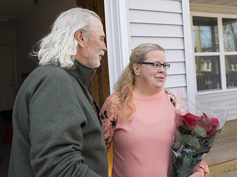 Habitat for Humanity former president Brad Hunsberger congratulates Heather Dingley on her new home Sunday, Nov. 19, 2023.