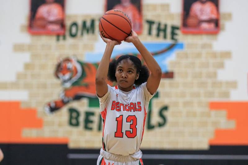 Plainfield East's Jocelyn Trotter (13) shoots a free throw during varsity basketball game between Yorkville at Plainfield East.  Jan 3, 2023.