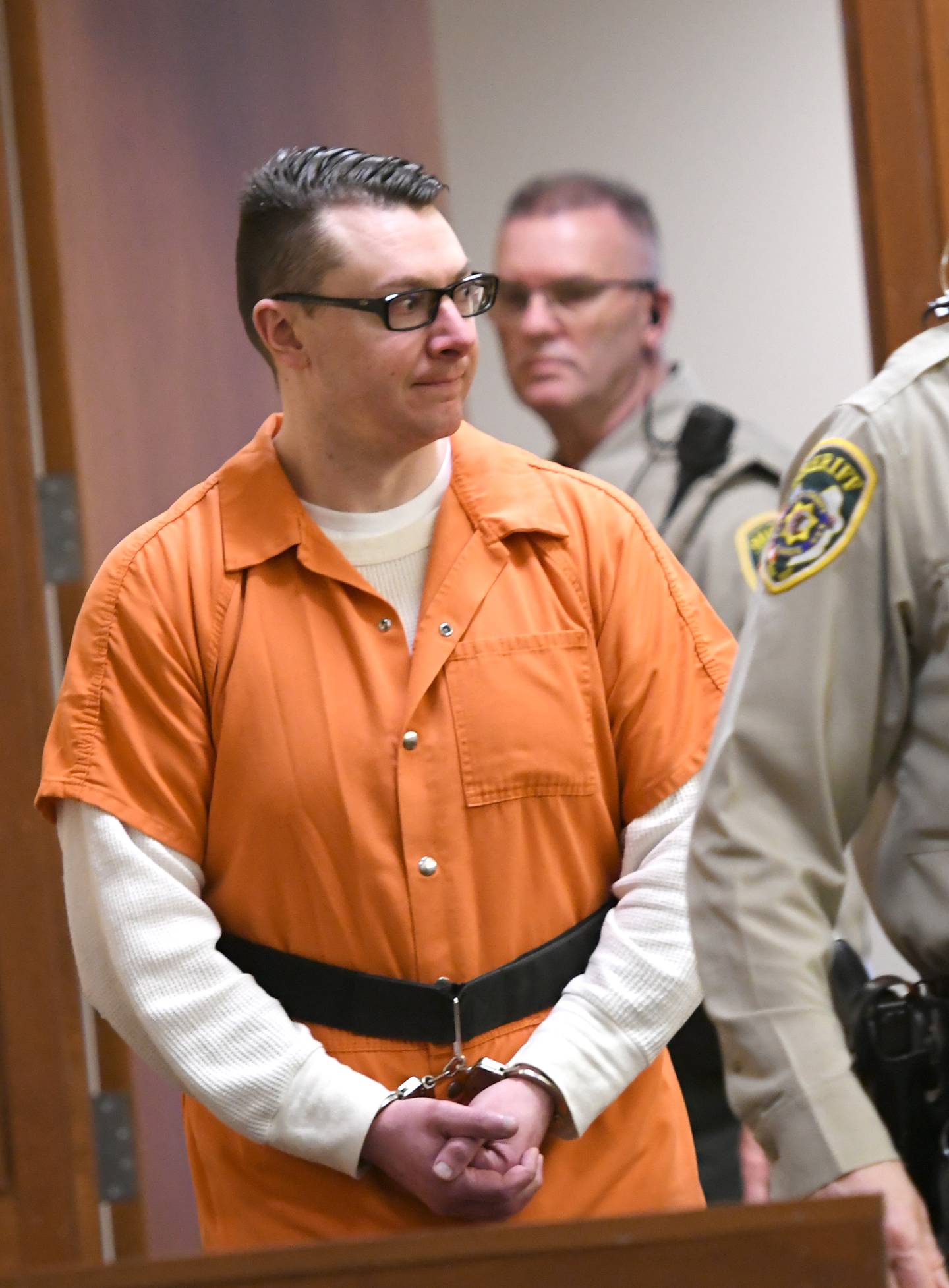 Duane Meyer is escorted into an Ogle County courtroom on Tuesday for a status hearing. He is charged with killing his ex-wife, Maggie Rosko, and their 3-year-old son, Amos.