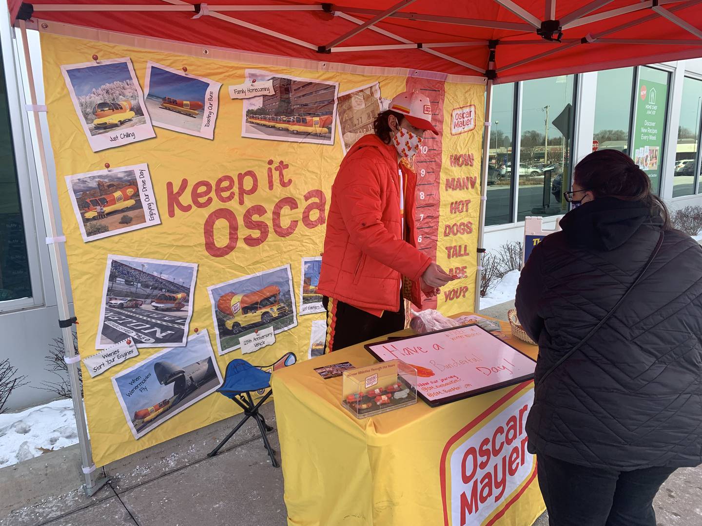 Brandon Mazzaferro of Crystal Lake and the driver of the Oscar Mayer Wienermobile visits with customers outside Mariano's in Crystal Lake on Sunday, Jan. 16, 2022.