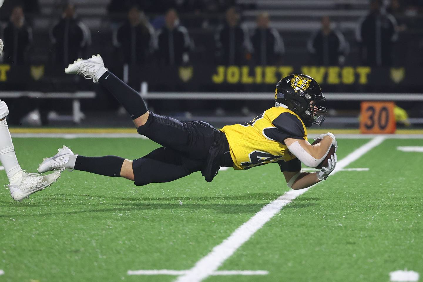 Joliet West’s Gavin Garcia makes a diving catch for a first down against Plainfield East on Friday, Oct. 13, 2023 in Joliet.