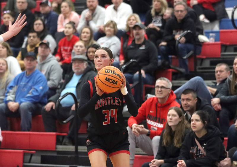 Huntley’s Ava McFadden sets up an outside shot against Maine South in Komaromy Holiday Classic varsity girls basketball championship game action on Monday, Dec. 30, 2024, at Dundee-Crown High School in Carpentersville.