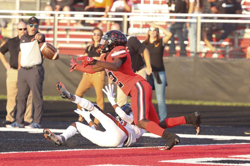Bolingbrook’s defensive back C.J. Jones makes a play on the ball against Minooka. Friday, Aug. 26, 2022, in Bolingbrook.