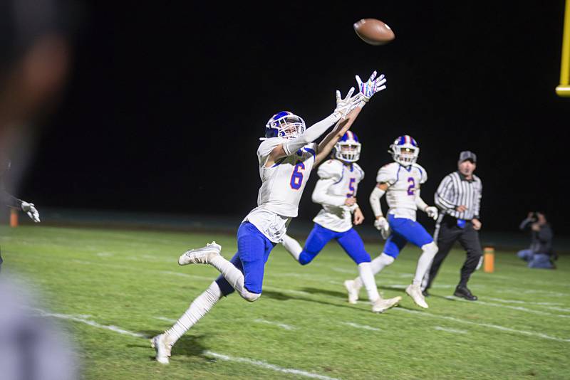 Genoa-Kingston’s Justyn Ferrara reaches but the pass is just out of reach Friday, Sept. 23, 2022 against Rock Falls.