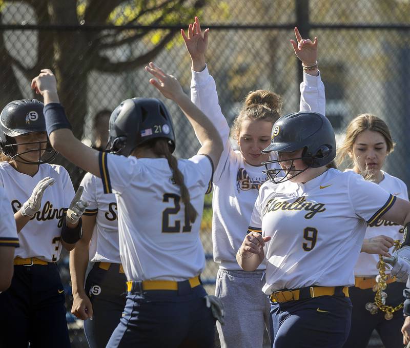 Sterling’s Ellie Leigh crosses the plate after hitting a solo shot against Morrison Wednesday, April 26, 2023.
