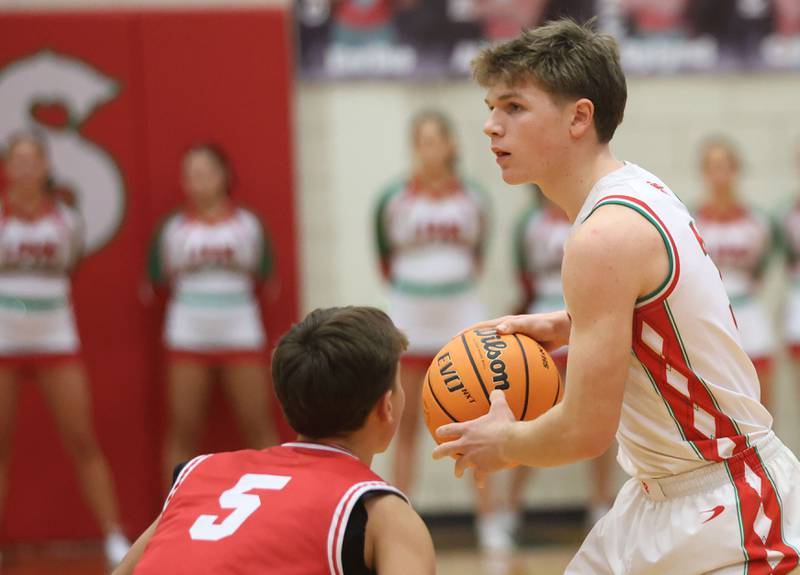 L-P's Braylin Bond looks to pass the ball around Ottawa's Rory Moore on Friday, Jan. 9, 2026 in Sellett Gymnasium at L-P High School.