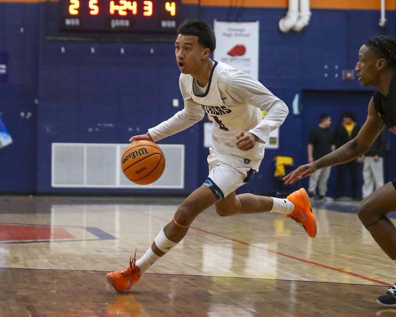 Oswego's Ethan Vahl (3) turns the corner on a drive to the basket during their basketball game between Yorkville at Oswego, Feb 7, 2026 in Oswego.