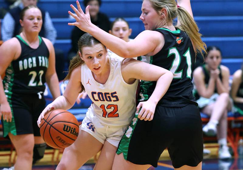Genoa-Kingston's Ally Poegel goes around Rock Falls' Nicolette Udell during their game Friday, Feb. 2, 2024, at Genoa-Kingston High School.
