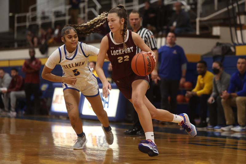 Lockport’s Kara Osinski drives to the baseline against Joliet Central.