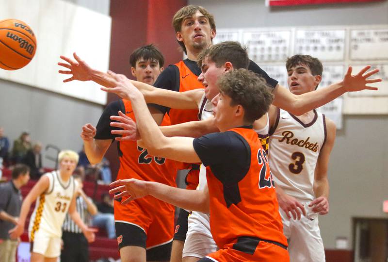 Crystal Lake Central’s Logan Laudadio, front, and others tussle under the net in varsity boys basketball E.C. Nichols tournament championship game action on Saturday, Dec. 27, 2025, at Homer “Bill” Barry Gymnasium on the campus of Marengo High School in Marengo.