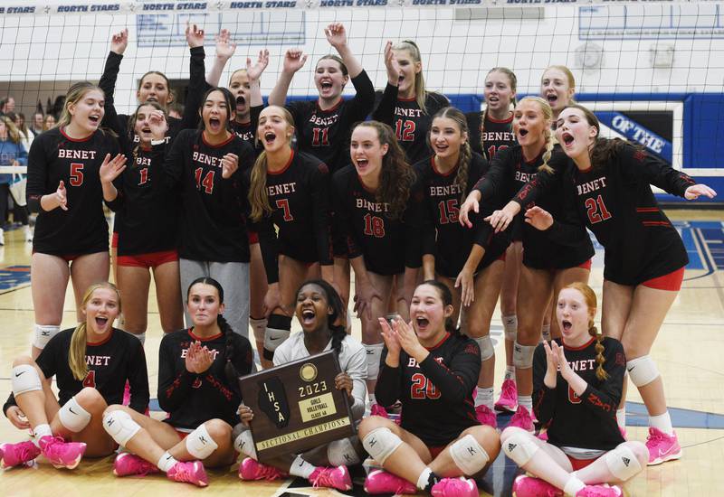 Joe Lewnard/jlewnard@dailyherald.com
Benet Academy players celebrate their victory over Glenbard West during the Class 4A girls volleyball sectional final at St. Charles North Wednesday.