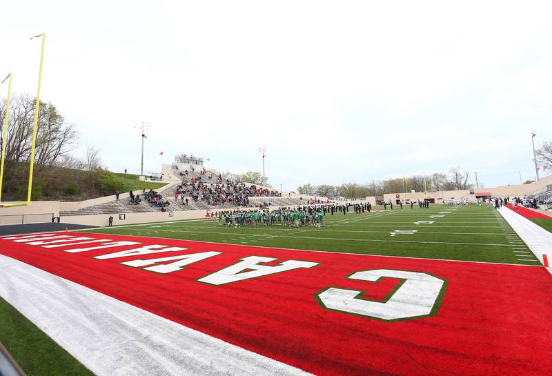 L-P and Kaneland warmup before the football game at Howard Fellows Stadium. La Salle-Peru Township High School dedicated the artificial turf field at halftime.