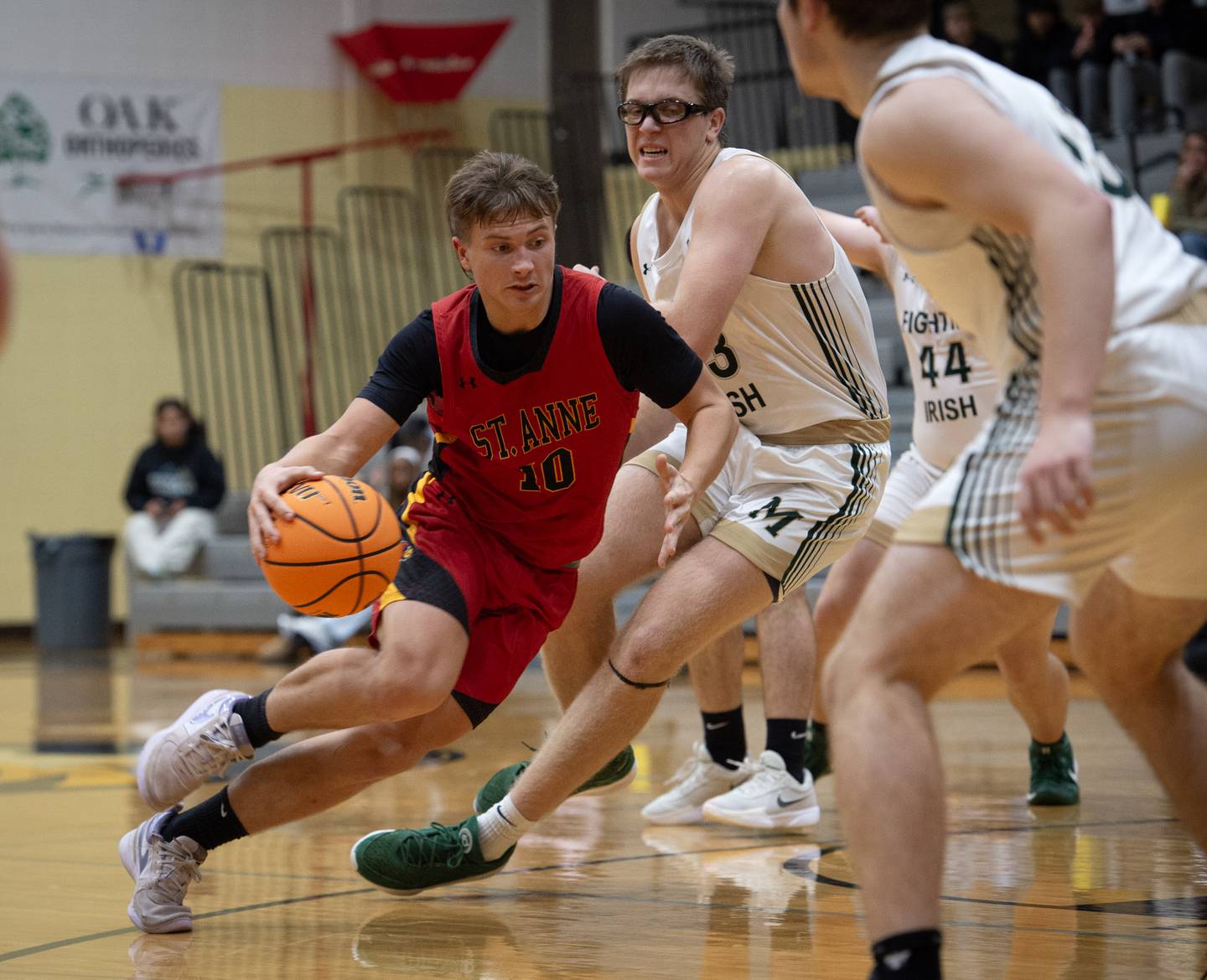 St. Anne's Grant Pomaranski, left, makes a break toward the net past Bishop McNamara's Callaghan O'Connor in a game on Wednesday, November 26, 2025.