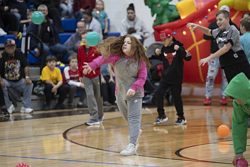 Competitors fire balls at the Grinch team Saturday, Nov. 18, 2023. The event took place in the gym at Rock Falls Middle School.