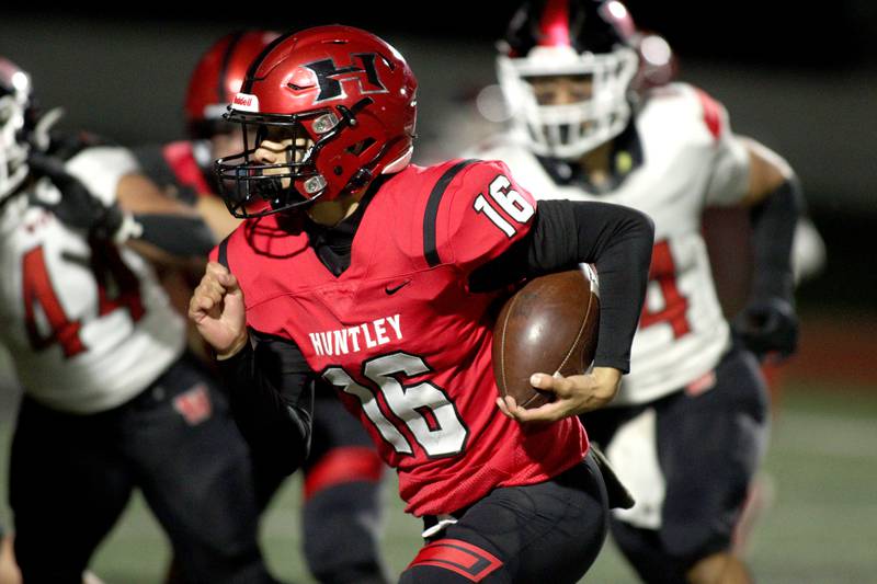 Huntley’s Braylon Bower runs the ball against Niles West in first-round Class 8A playoff football action at Huntley Friday.