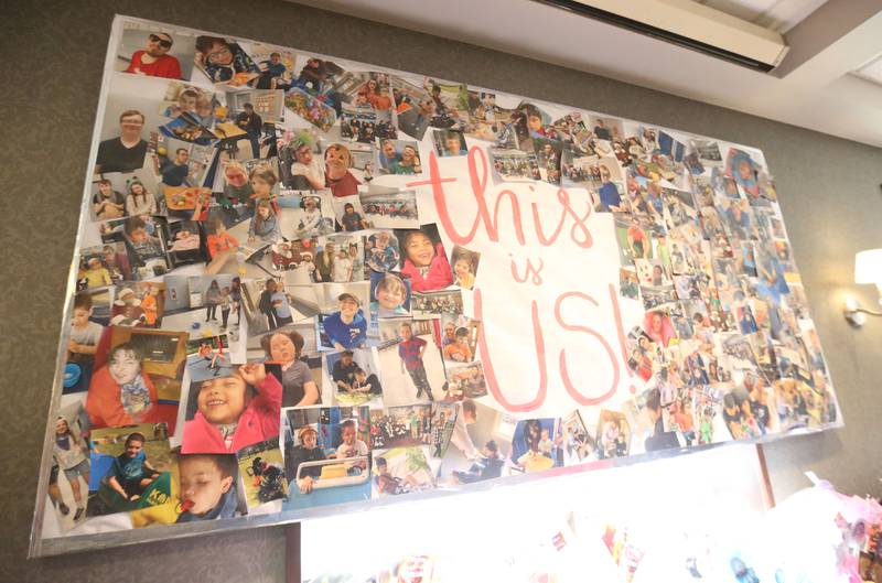 A large picture board reads "this is us" during the Lighted Way spaghetti dinner on Monday, April 28, 2025 at Uptown Bar & Grill downtown La Salle. This year’s spaghetti supper educates the community about the different syndromes and disabilities the children have.