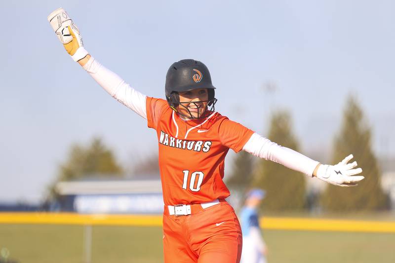Lincoln-Way West’s Molly Finn has fun at first base after driving in a run against Plainfield South on Tuesday, March 24, 2026 in Plainfield.