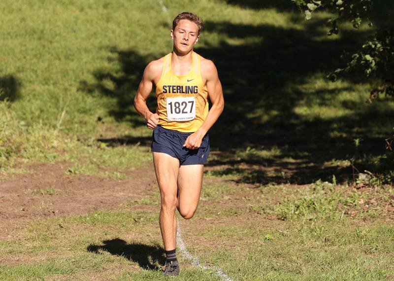 Sterling's Dale Johnson runs in second place out on the course Tuesday, Aug. 30, 2022, during the Sycamore Cross Country Invitational at Kishwaukee College in Malta. Johnson went on to finish in second.