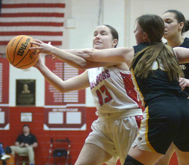 Herschel’s Pippa Dunnill works to stop this shot by Streator’s Izzy Mahan in the 1st period Tuesday at Streator.