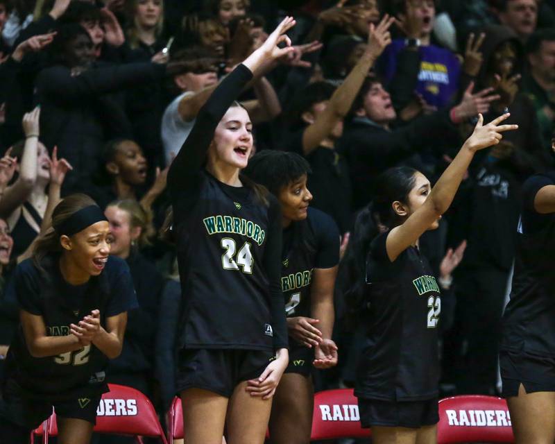 Waubonsie Valley's bench cheers on the team during their Class 4A Bolingbrook Sectional final basketball game between Waubonsie Valley at Benet. Feb 27, 2025 in Bolingbrook.
