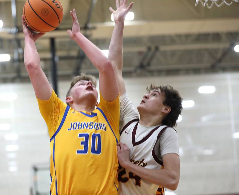 Johnsburg's Jayce Schmitt puts up a shot against Richmond-Burton's Landon Nelson during a Kishwaukee River Conference boys basketball game on Tuesday, Jan. 27, 2026, at Richmond-Burton High School.