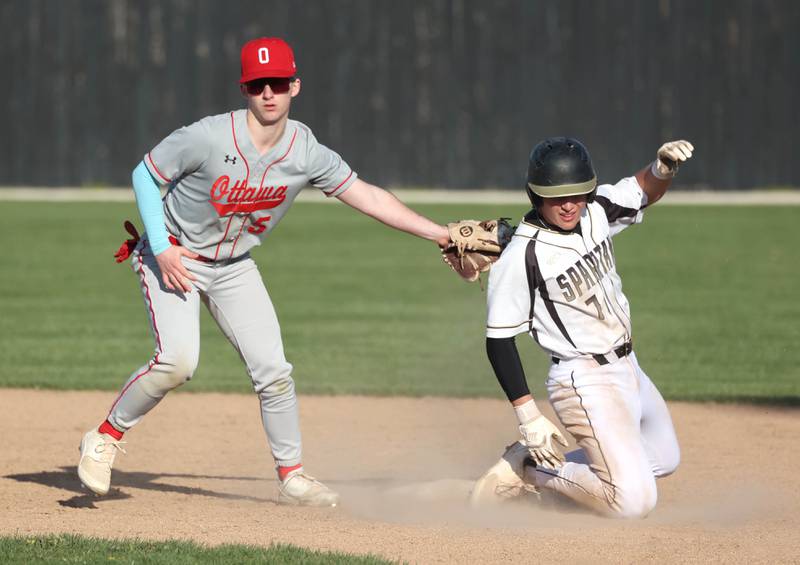 Ottawa's Jacob Rosetto applies the late tag as Sycamore's Nathan Lojko steals second during their game Friday, April 19, 2024, at the Sycamore Community Sports Complex.