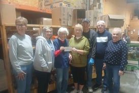 Quartermania donates nearly $1K to Streatorland Food Pantry