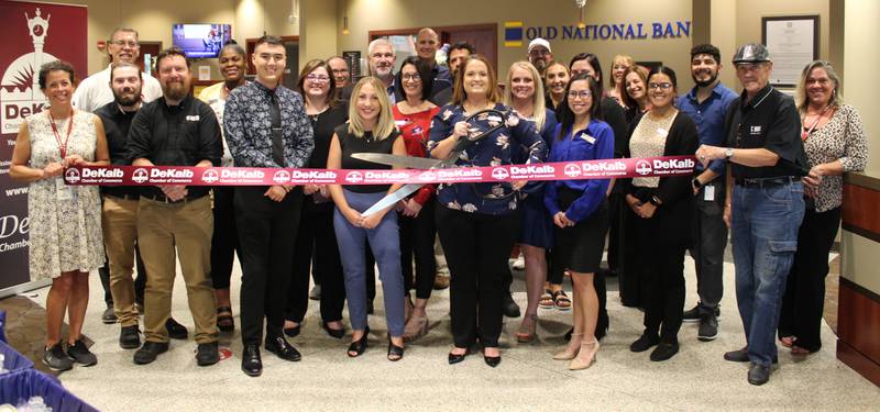 DeKalb Chamber staff, ambassadors, board members, and community members celebrating Old National Bank merging with First Midwest Bank.