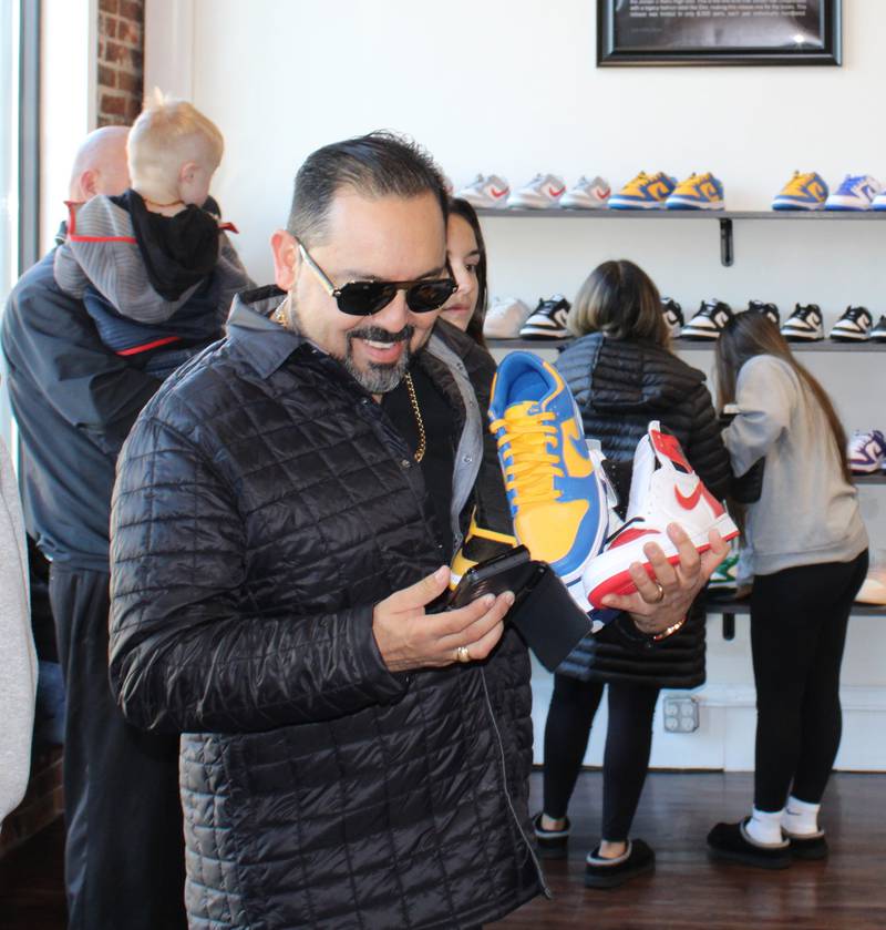 Customer Jose G. Uresti is all smiles with his selection of sneakers at Sole Statement in Sterling.