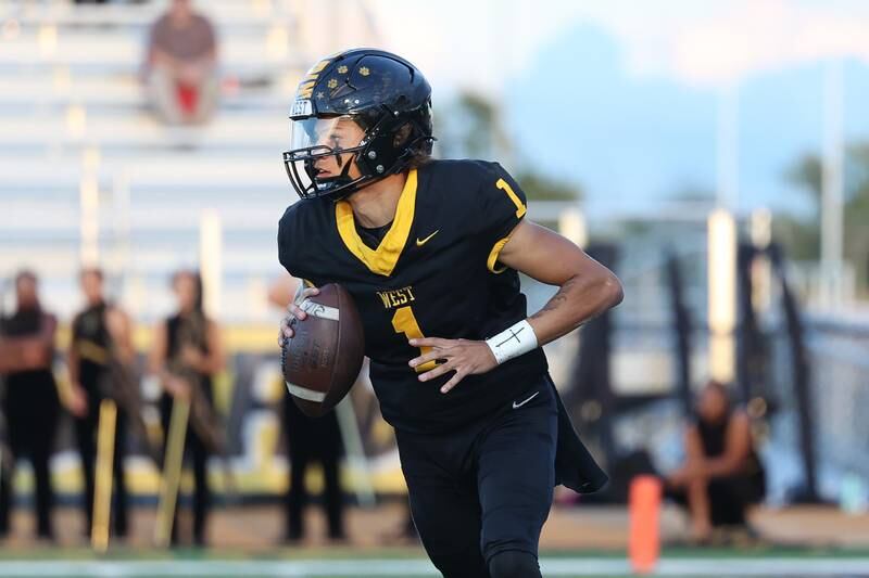 Joliet West’s Antoine Brooks looks to pass against Morris on Friday, Sept. 6, 2024 in Joliet.