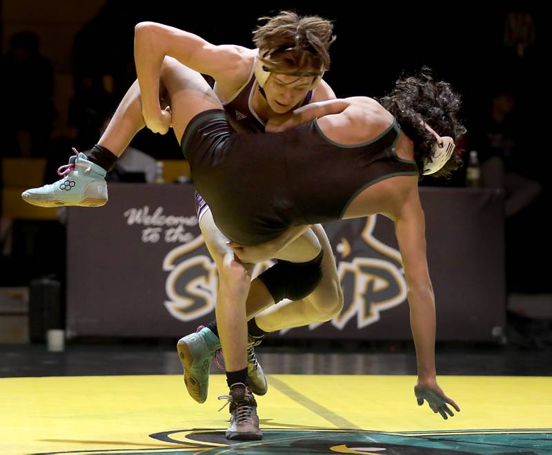Hampshire’s Lou Jensen takes down Crystal Lake South’s Ricky Briones during the 126-pound match of a Fox Valley Conference wrestling meet on Thursday, Jan. 15, 2026, at Crystal Lake South High School.