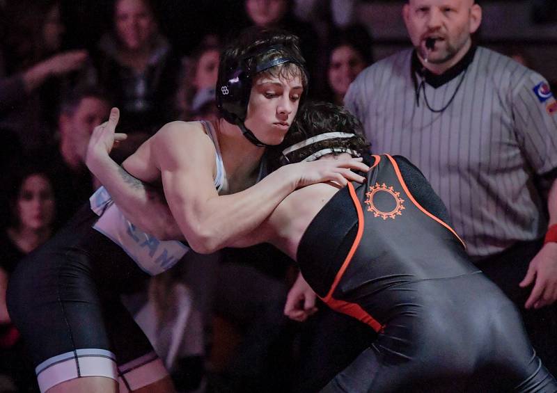 Marian Central's Josh Gowronski and St. Charles East's Jayden Colon wrestle at 150 pounds during a match in St. Charles on Wednesday, December 20, 2023.