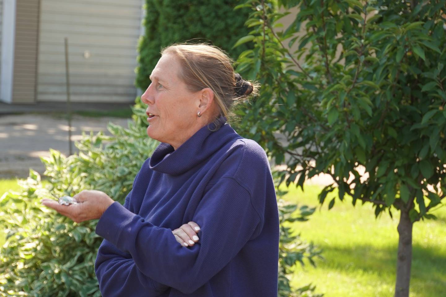 Kristine McNeilly speaks during the Aug. 26 dedication of a garden in Rochelle honoring her late mother, Diane McNeilly.