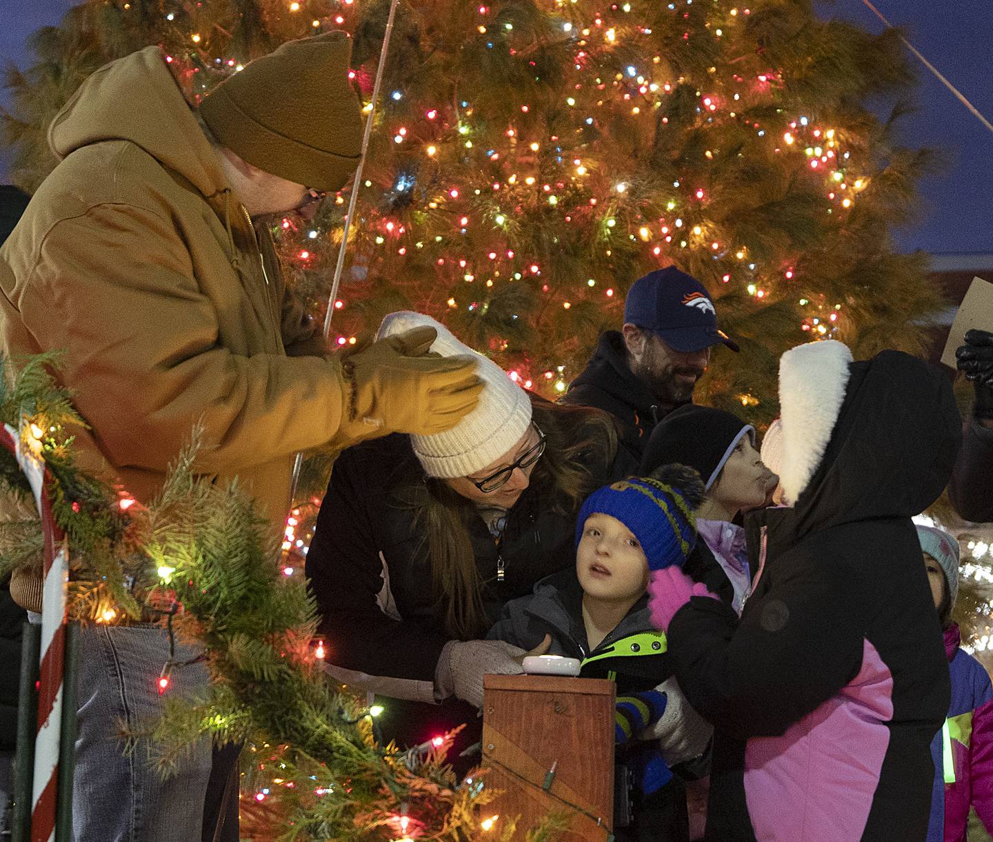 Surrounded by dad Chris, mom Barb and big sister Olivia, 7, Malachi Reiners, 5, of Dixon had the honor of pushing the button to light up the Christmas tree Friday, Dec. 6, 2024, to kick off Dixon’s Christmas Walk.