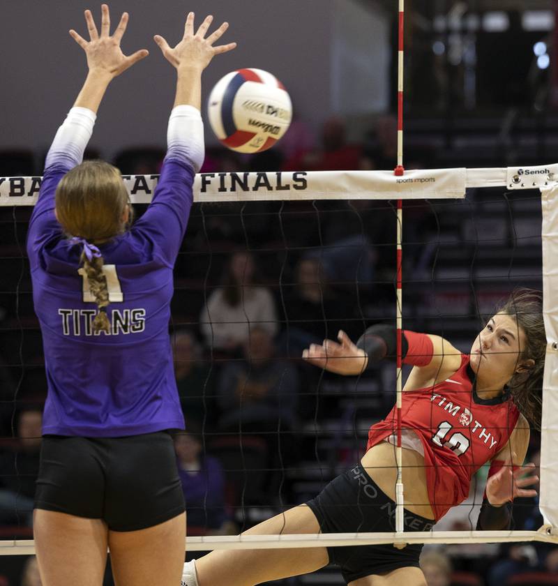Timothy Christian's Bella Potempa spikes against El Paso-Gridley's Reese Deckard Saturday, Nov. 16, 2024, in the Class 2A third place state volleyball match at CEFCU Arena in Normal.