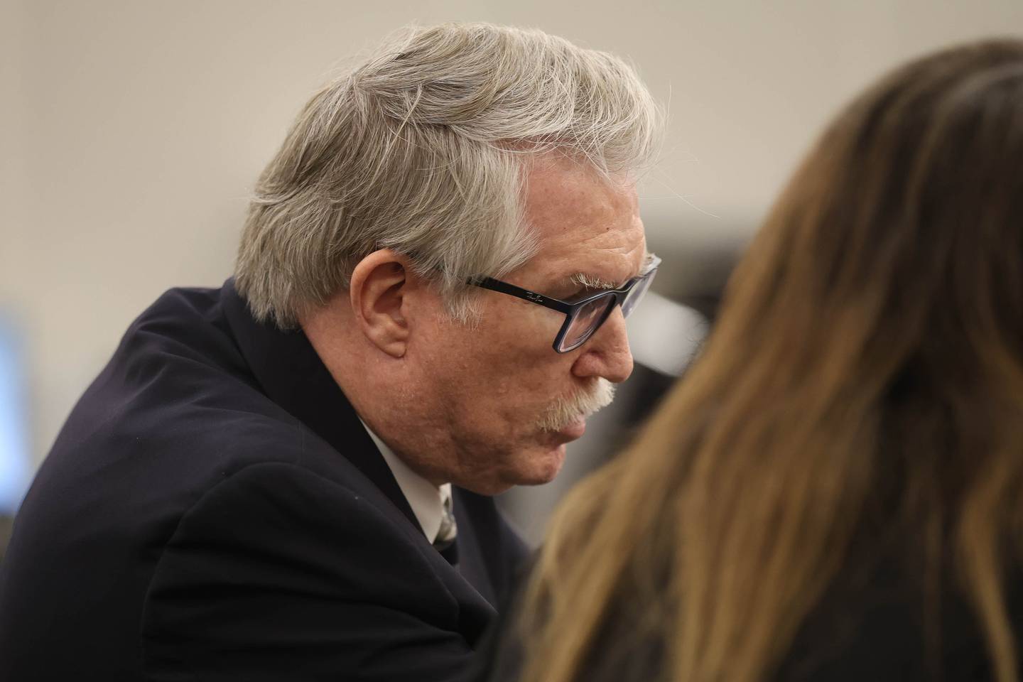 Will County Assistant States Attorney Scott Pyles confers with a colleague during a hearing Monday on the case challenging Joliet City Council member Juan Moreno's legitimacy to hold office. Monday, Dec. 8, 2025 at the Will County Courthouse in Joliet.
