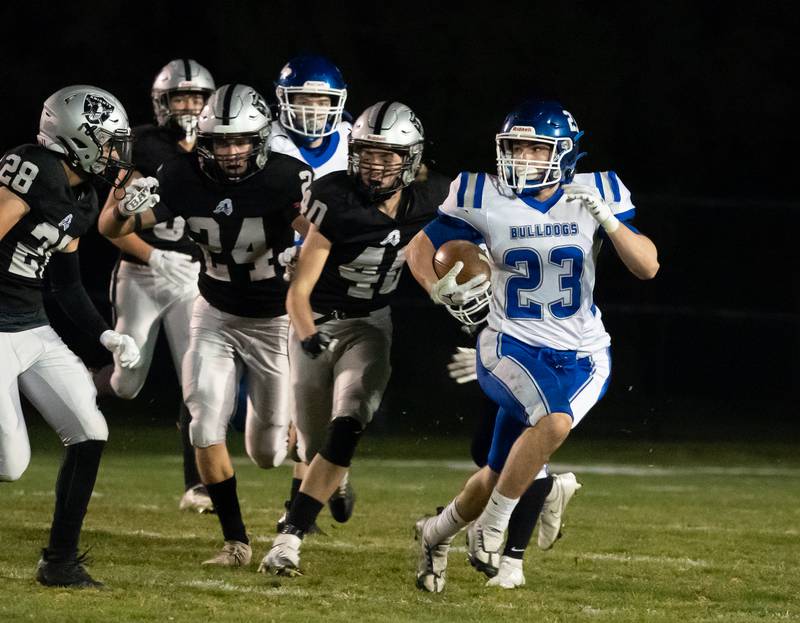 Riverside Brookfield's Drew Swiatek (23) returns a kickoff against Kaneland during a 6A playoff football game at Kaneland High School in Maple Park on Friday, Oct 28, 2022.