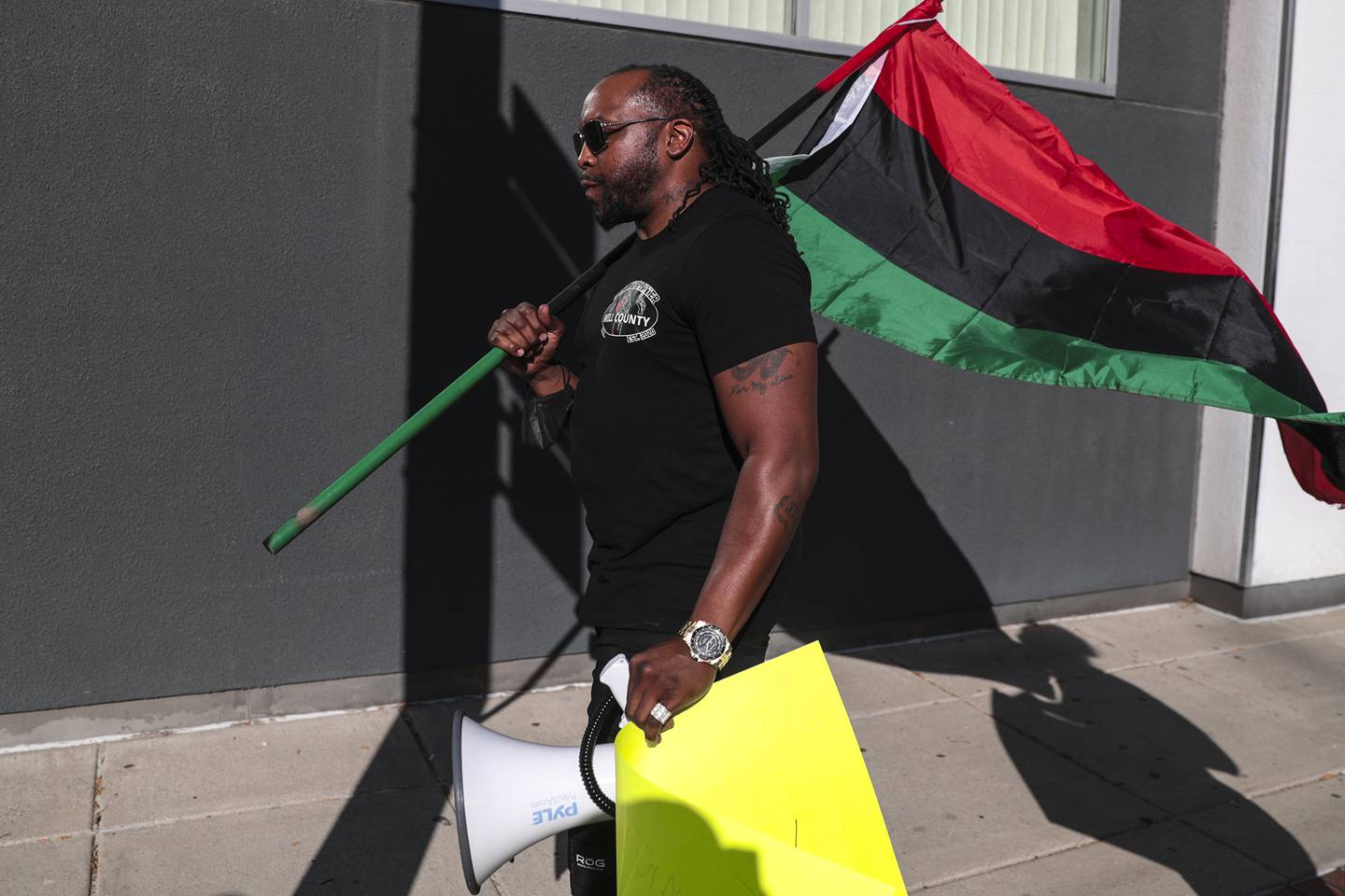 Joliet Black Lives Matter activist Karl Ferrell marches to call for further investigation into the death of Eric Lurry, a Joliet resident who died while in police custody, on Friday, Sept. 17, 2021, outside of the District AttorneyÕs Office in Joliet, Ill.