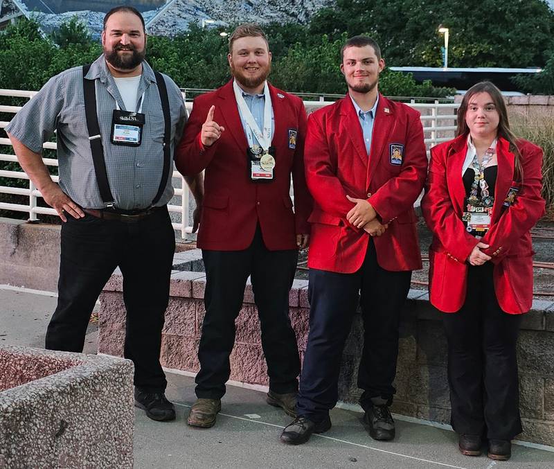 (Left to right); Kishwaukee College assistant professor of diesel power technology Don Flink and Kishwaukee College SkillsUSA team members Cole Wilke, Christian Thorne, and Lily Goode