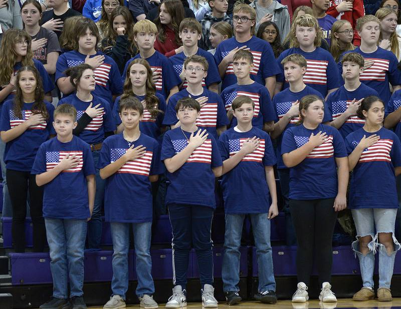 The 8th grade class of Serena Grade School, stands at attention during the Pledge of Allegiance during a Veterans Recognition Ceremony Tuesday at Serena High School.