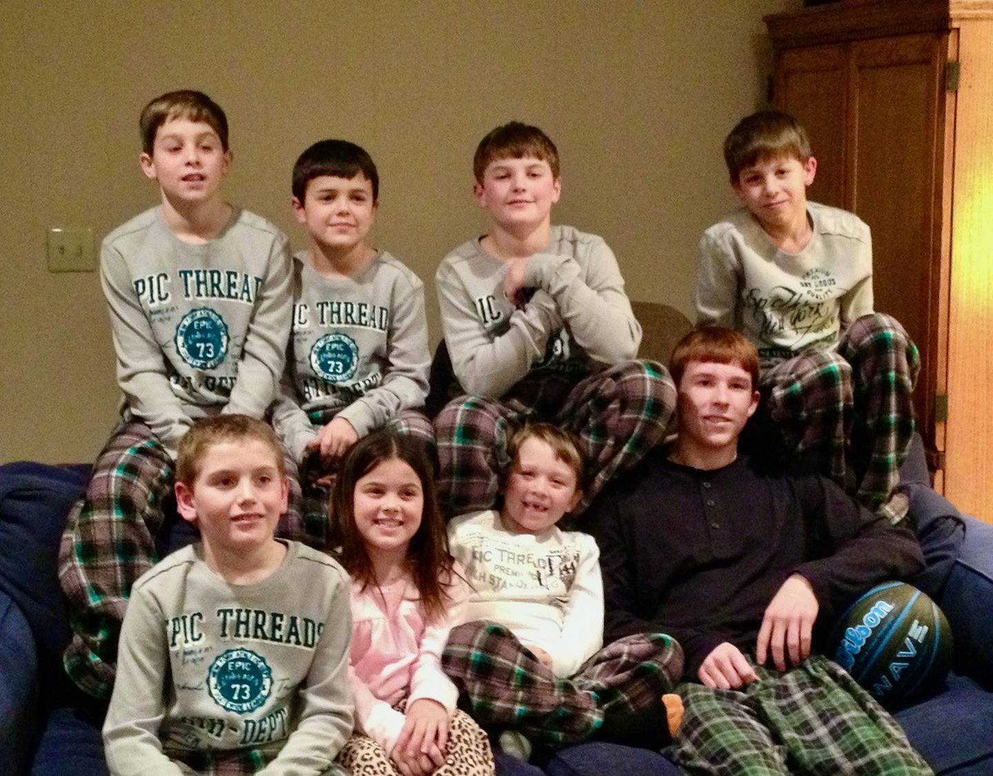 The Reinhardt cousins gather for a family picture at Christmas in 2012. Just eight months earlier, they had an Easter Miracle when Jordan Reinhardt, 5, survived an accident while they all were riding a Kawasaki Mule. Pictured are Caden Brooks (front, left), Olivia Alter, Jordan Reinhardt and Jake Reinhardt; and (back row) Josh Reinhardt, Caleb Alter, Conner Alter and Jamie Reinhardt.