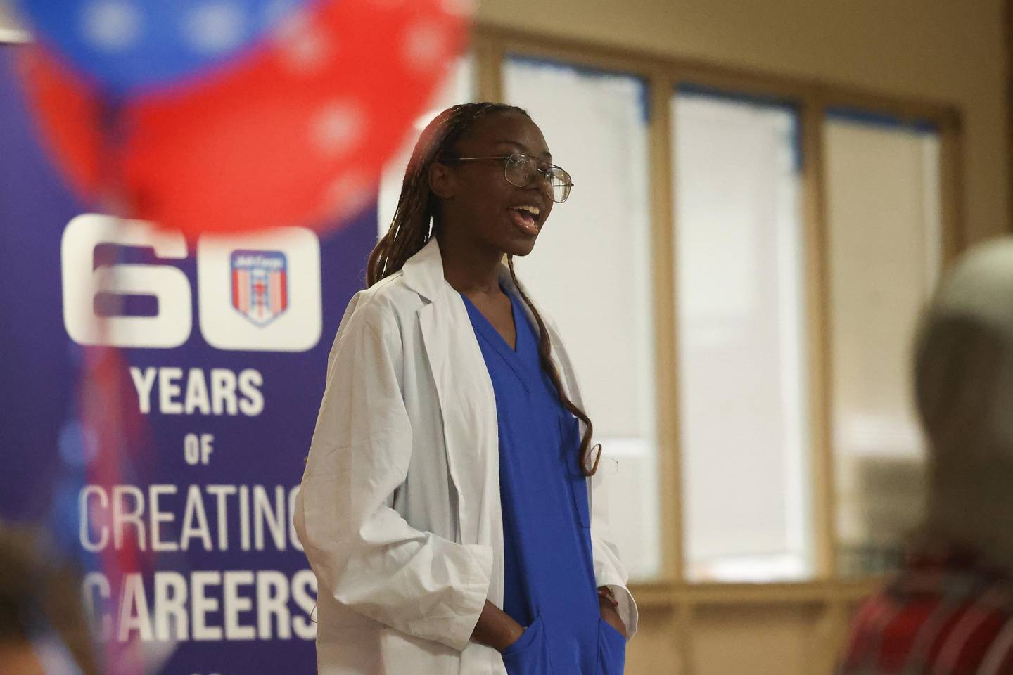 Shanya Anderson, who recently completed the CNA program and pass the Illinois state exam, speaks at the Joliet Job Corps 60th anniversary open house on Thursday, August 29, 2024 in Joliet.