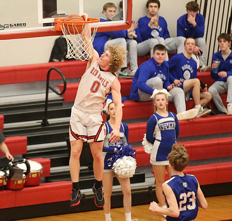 Hall's Mac Resetich dunks the ball over Newman's Lucas Simpson on Friday, Feb. 3, 2023 at Hall High School.