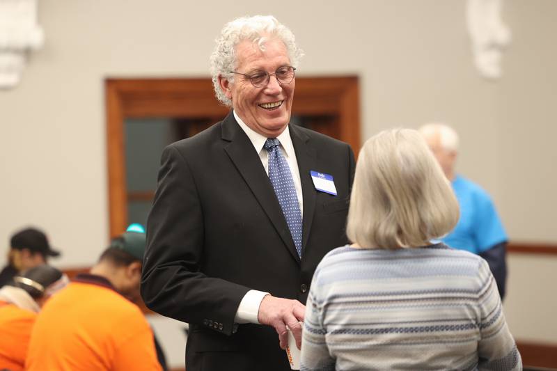 Candidate for Joliet City Council District 4 William Ferguson talks with a guest at a forum for the candidates at the Joliet Public Library on Thursday, March 9th, 2023 in Joliet.