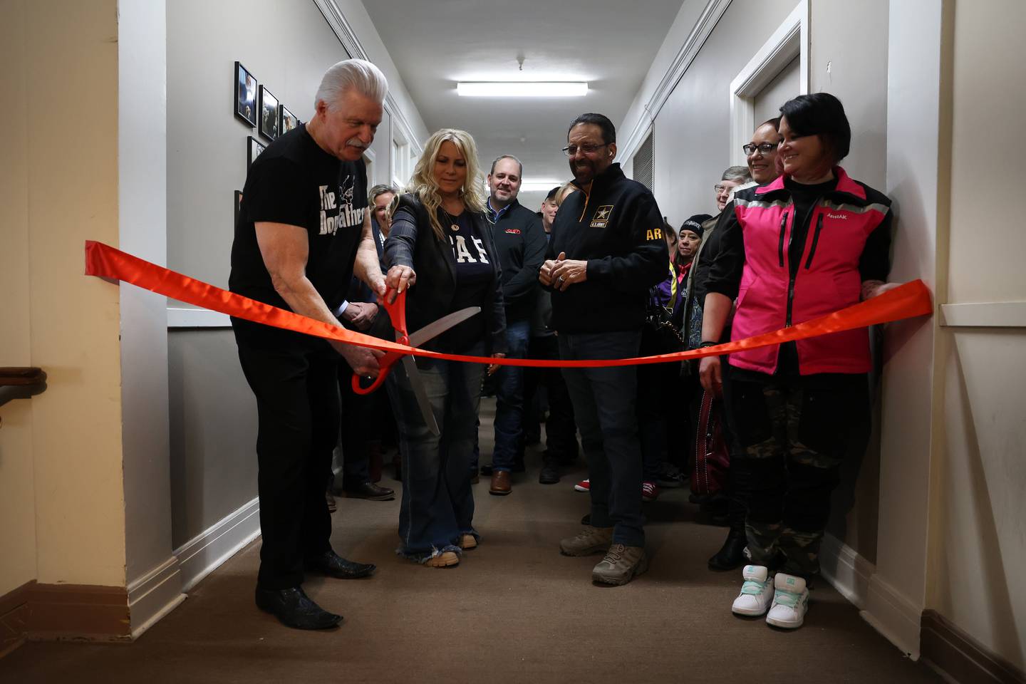Jim Glasgow (left) along with his wife, Gina, K9s for Veterans CEO and founder Michael Tellerino and dog trainer Kate McGrail cut the ceremonial ribbon. K9s for Veterans hosted a ribbon cutting ceremony for the opening of its new training campus on Wednesday, Feb. 15, 2023, in Joliet.